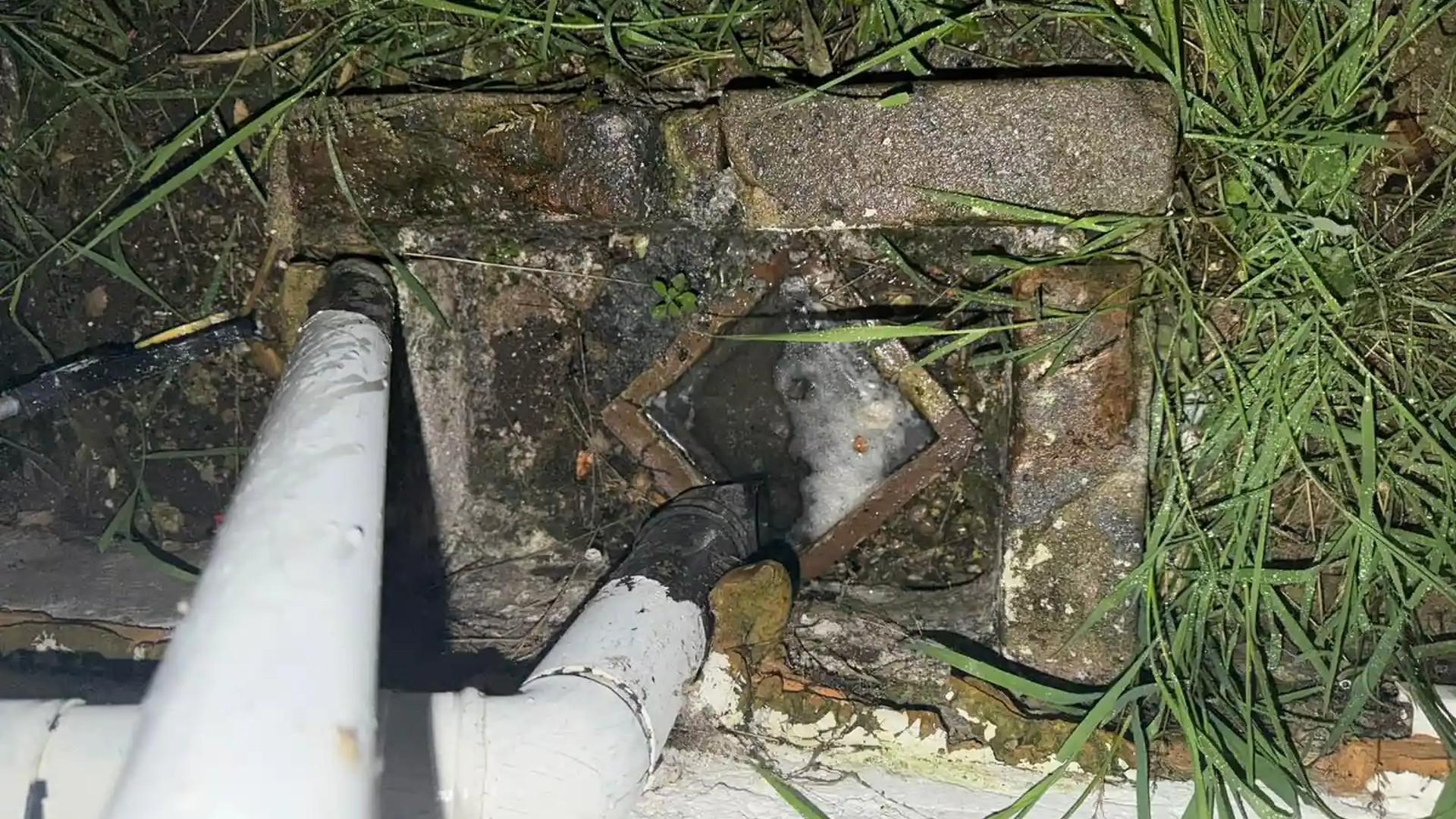 Precision Draincare engineer carrying out drain services at a Reading property