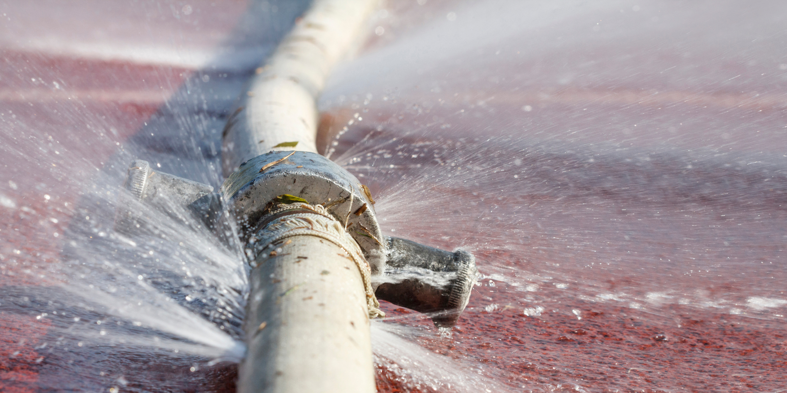 Precision Draincare engineer repairing a burst pipe at a Reading property